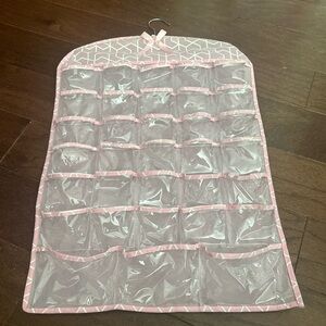Jewelry hanging storage bag with 33 individual pockets of storage